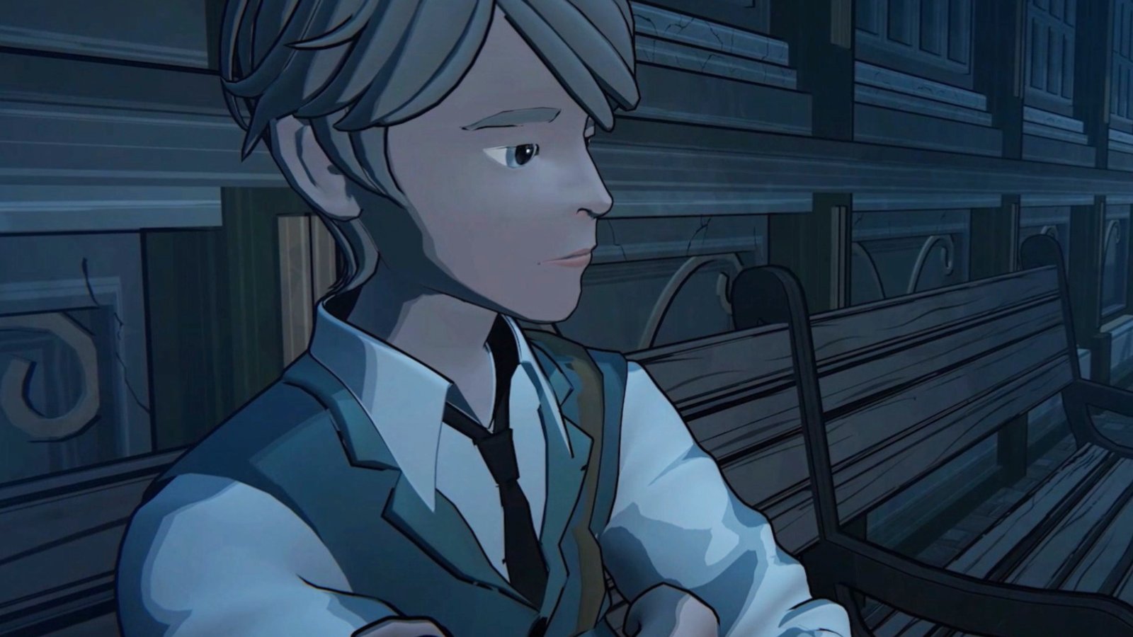 A young man in a tie looking pensive