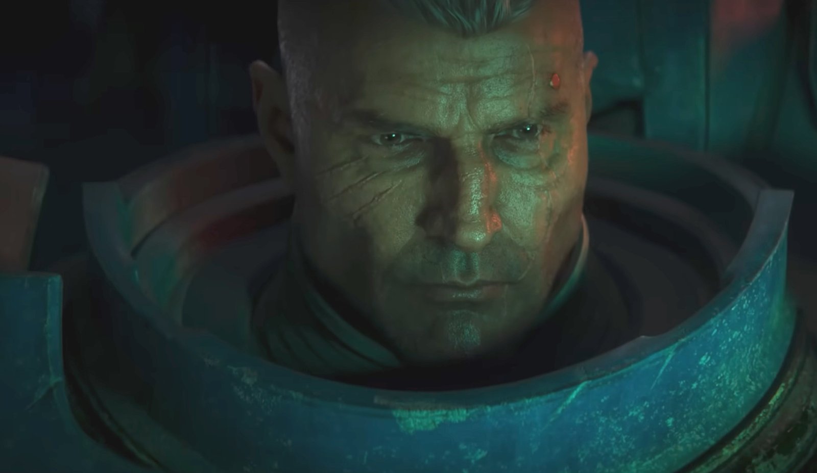 A Space Marine with his helmet off. He's older, with a strong jaw and steely eyes