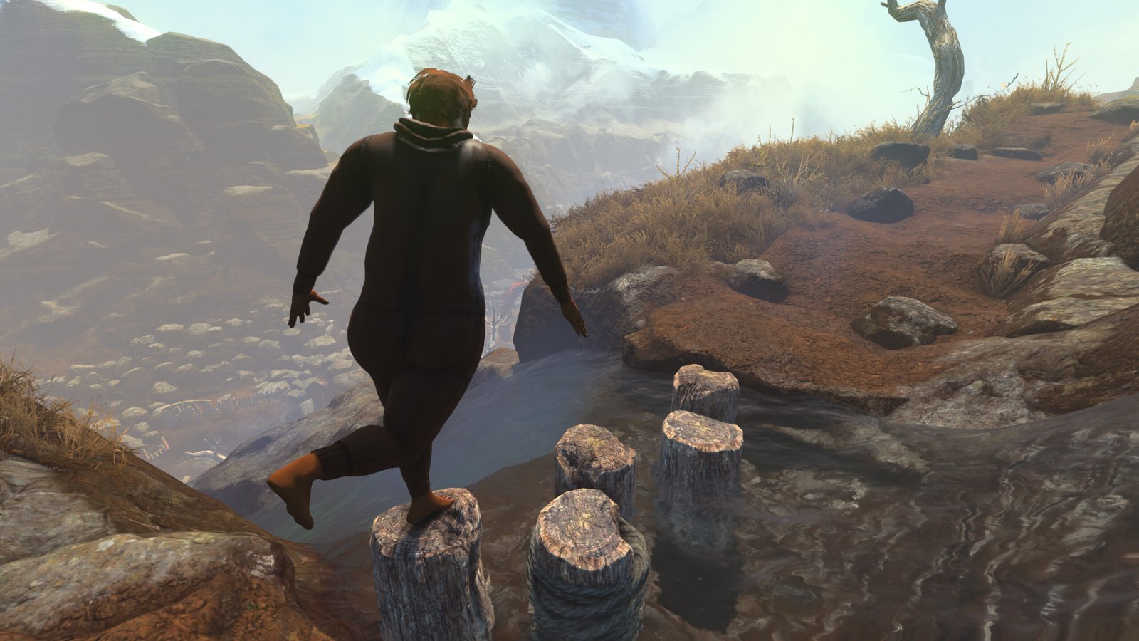 A man walking through the wilderness wearing a onesie